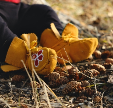 Tiny moccasins on toddler