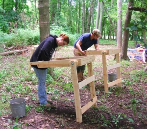Students sifting soil at a site