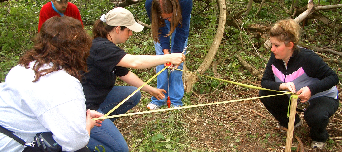 Students measuring an excavation site